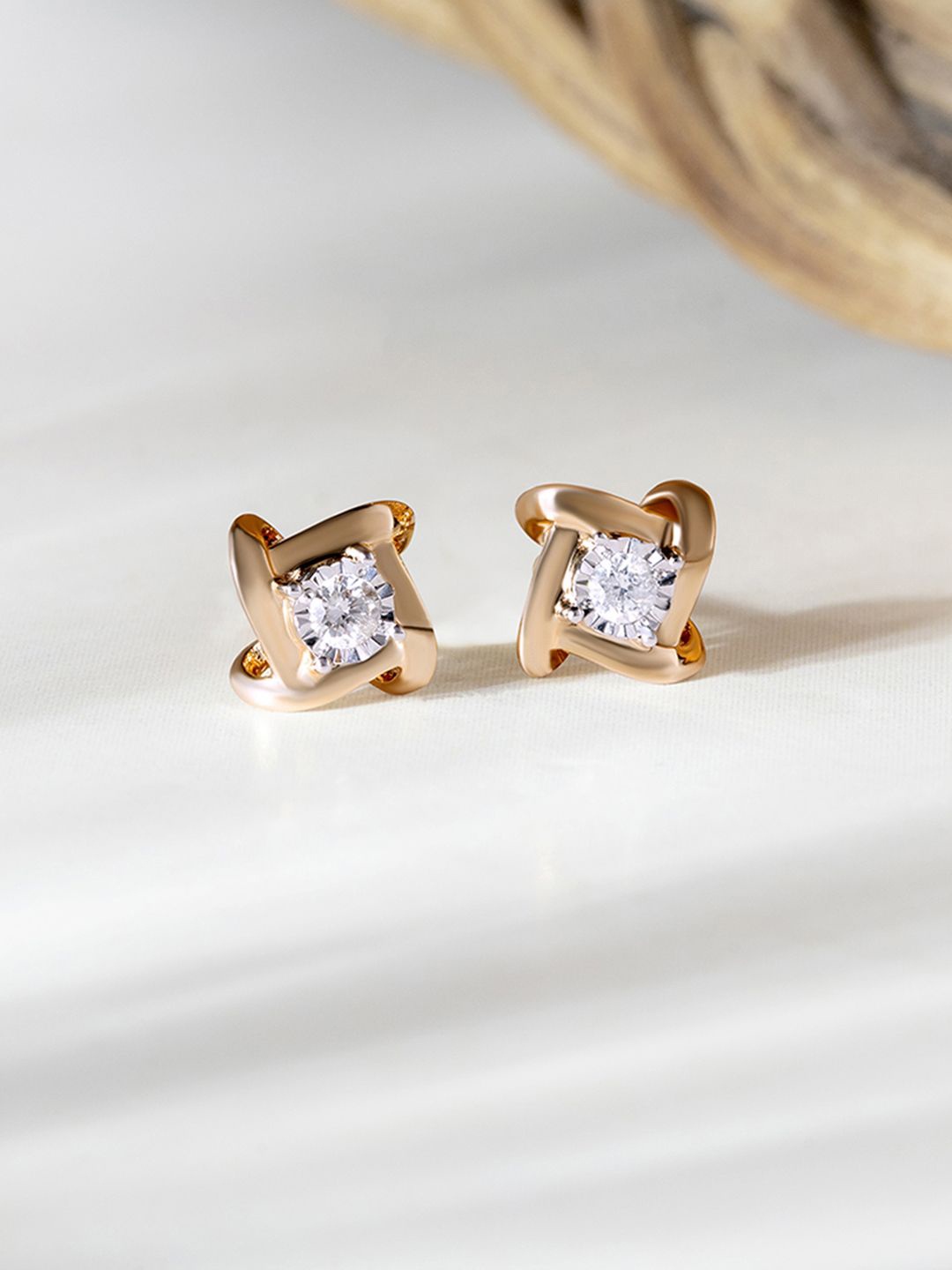 

Mia by Tanishq 14KT Gold and Diamond Stud Earrings 1.22gm, Yellow