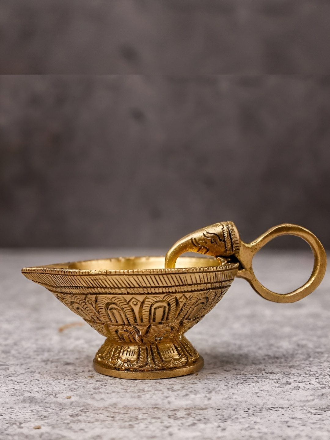 

The Advitya Gold Toned Brass Gajah Pooja Diya