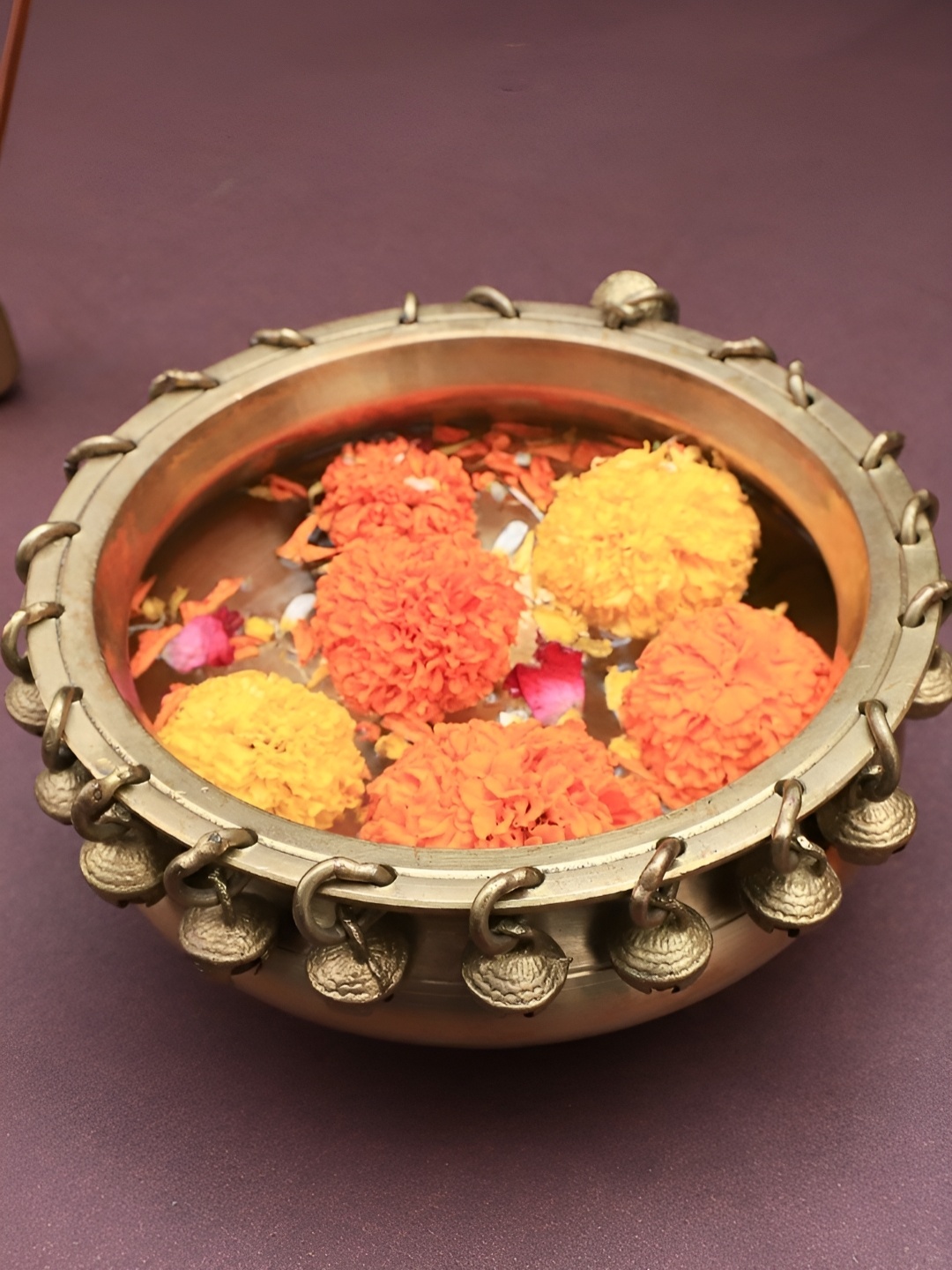 

The Advitya Gold Toned Brass Urli with Bell Decorative Bowl