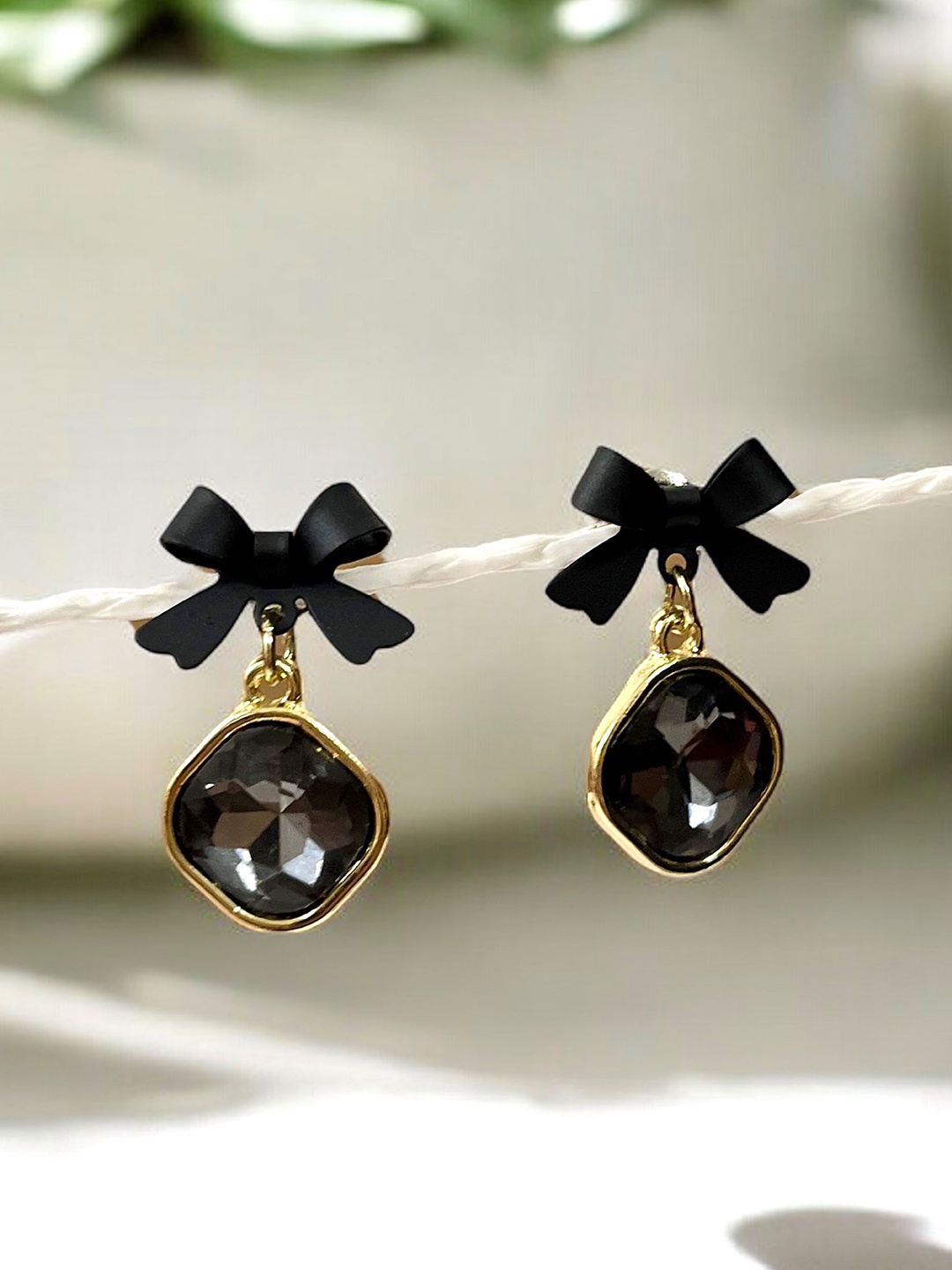 

SUBHAGALANKAR Brass-Plated Stone Studded Bow Shaped Drop Earrings, Black