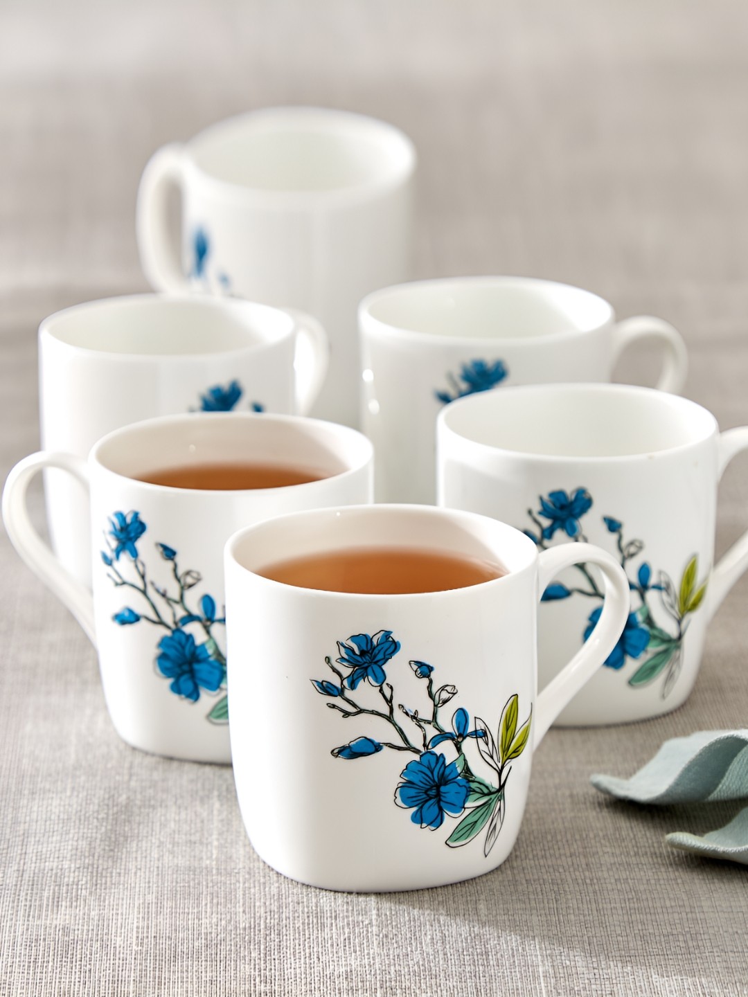 

Home Centre White & Blue Floral Printed Bone China Glossy Mugs Set of Cups and Mugs