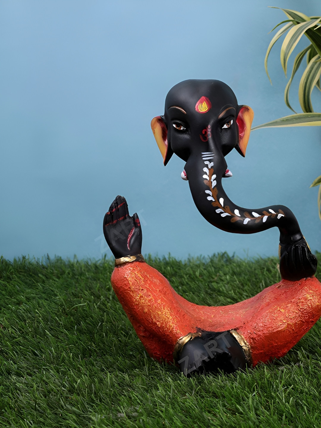 

Zart Orange & Black Ganesha Idol Showpiece