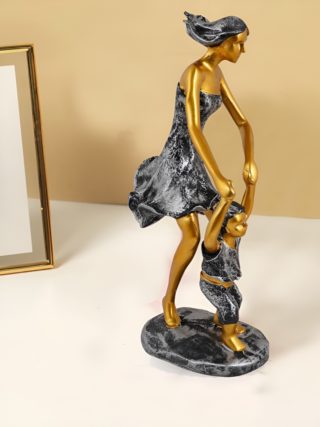 

Zart Gold-Toned Figurine Showpiece