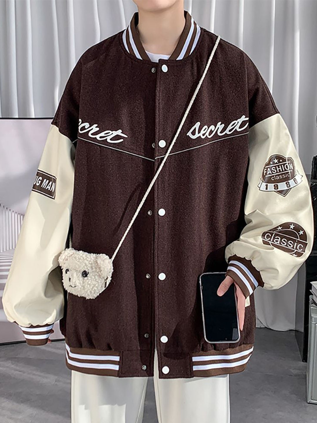 

StyleCast x Revolte Men Stand Collar Typography Printed Casual Varsity Jacket, Coffee brown