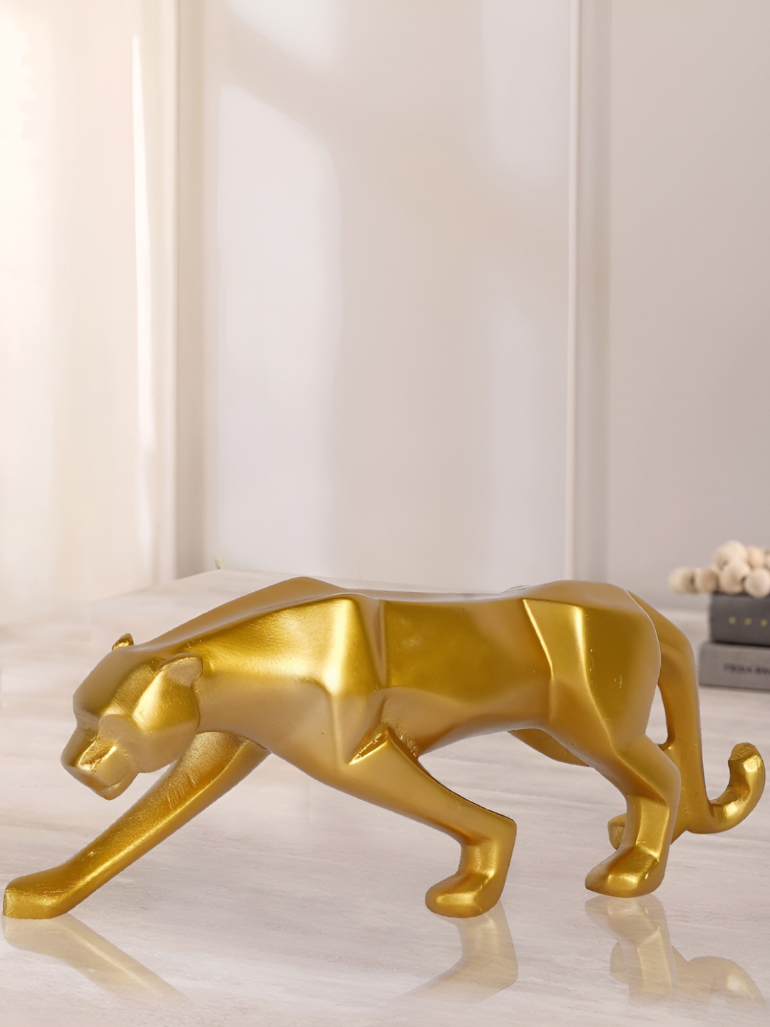 

Zart Gold-Toned Idol Showpiece