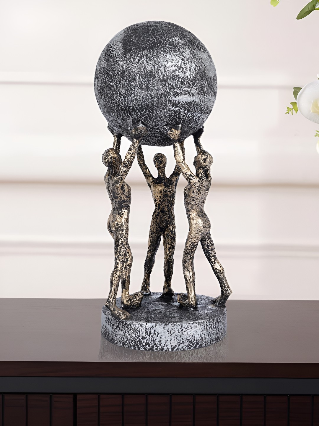 

Zart Gold-Toned & Black Men Group Carrying Earth Figurine Showpiece