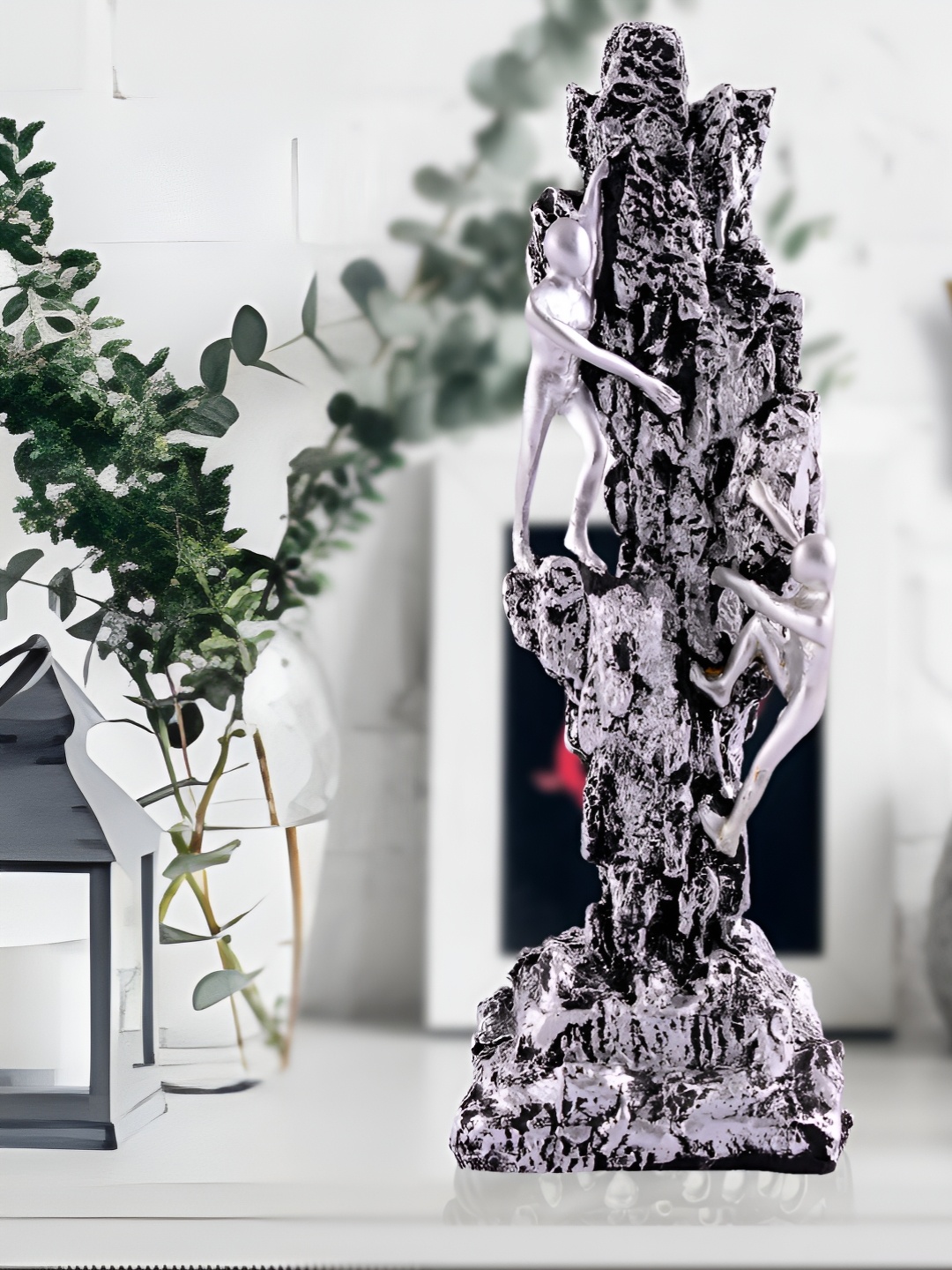 

Zart Silver-Toned Idol Showpiece