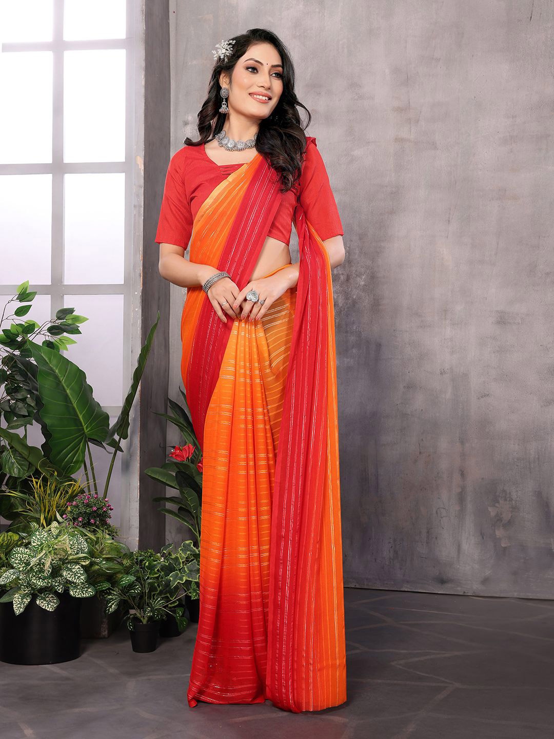 

Moda Rapido Women Striped Satin Saree, Orange