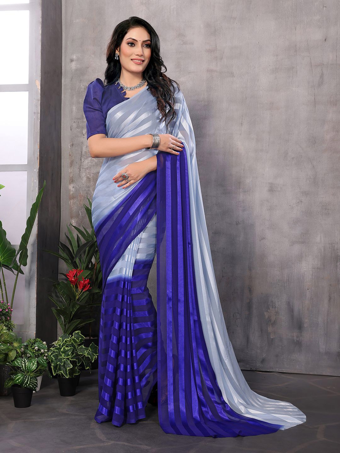 

Moda Rapido Women Striped Satin Saree, Blue