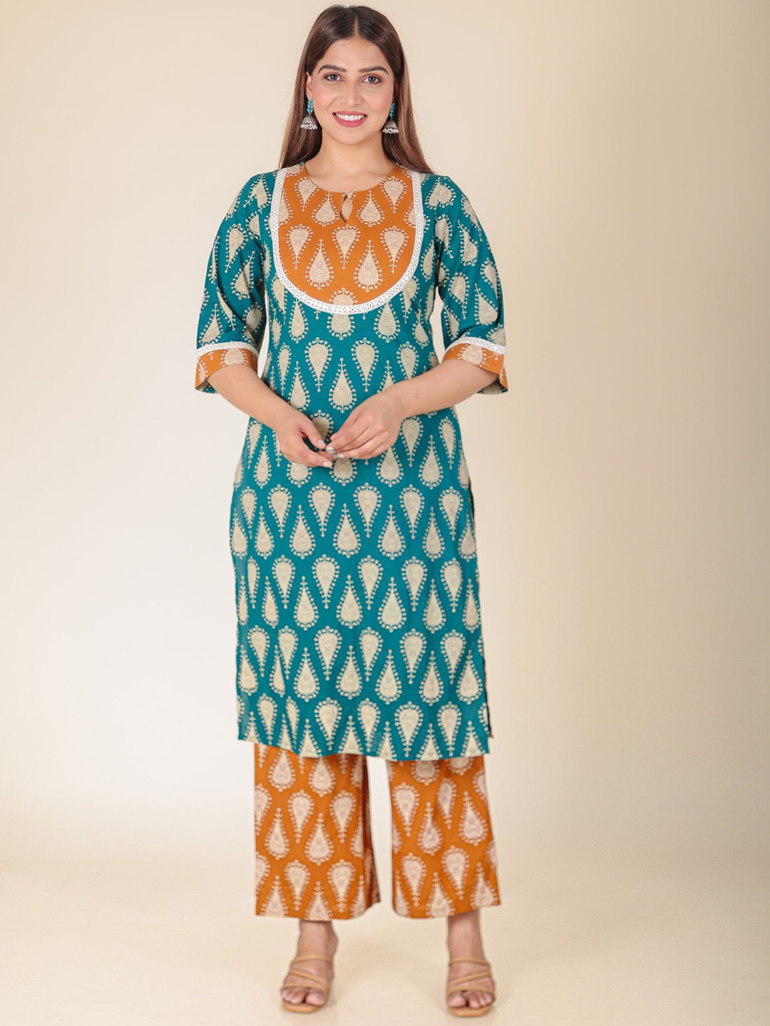 

Aramya Floral Printed Keyhole Neck Three-Quarter Sleeves Pure Cotton Kurta & Palazzo, Turquoise blue
