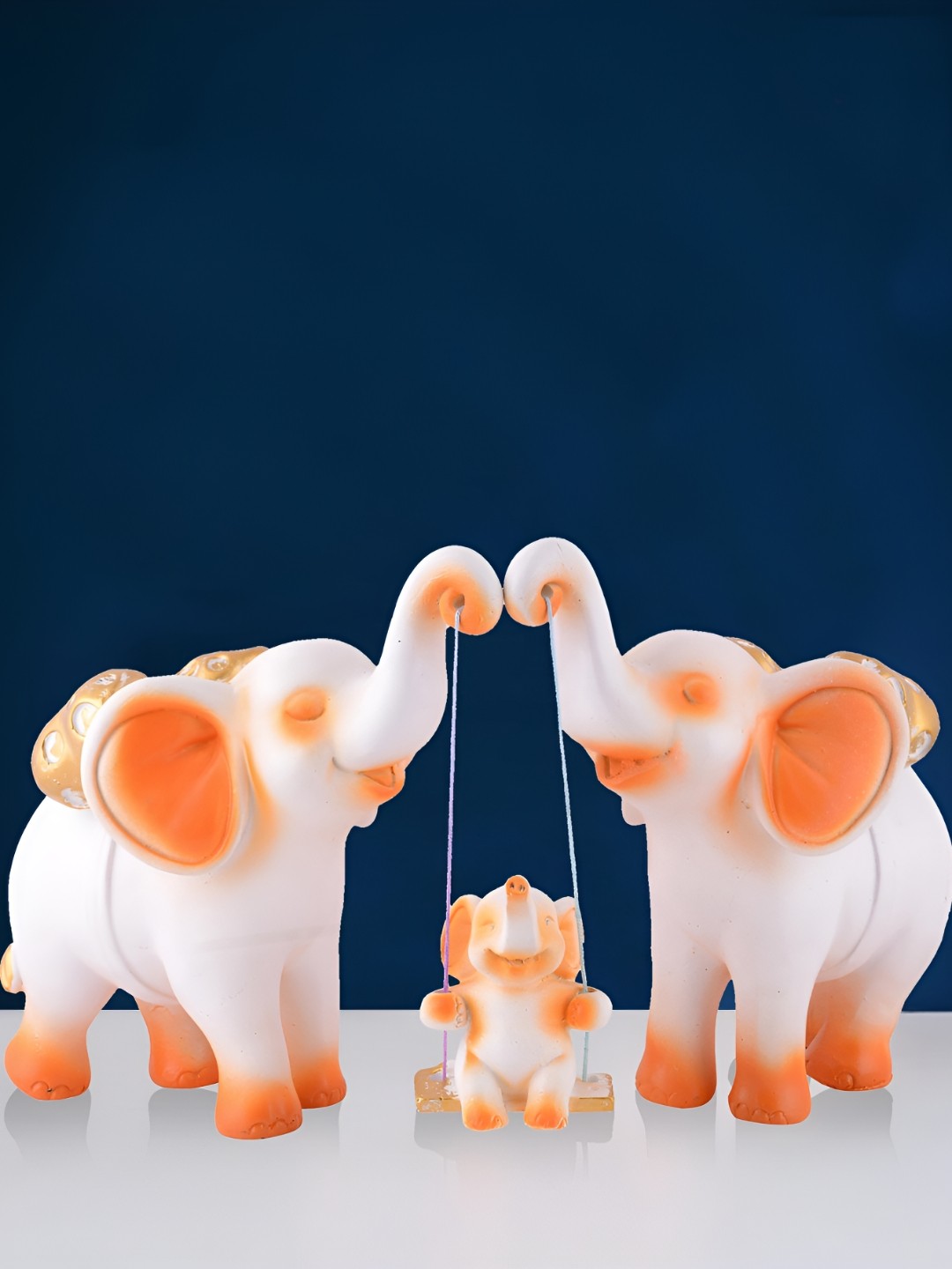 

Zart White & Peach Colored Elephant Family Showpiece