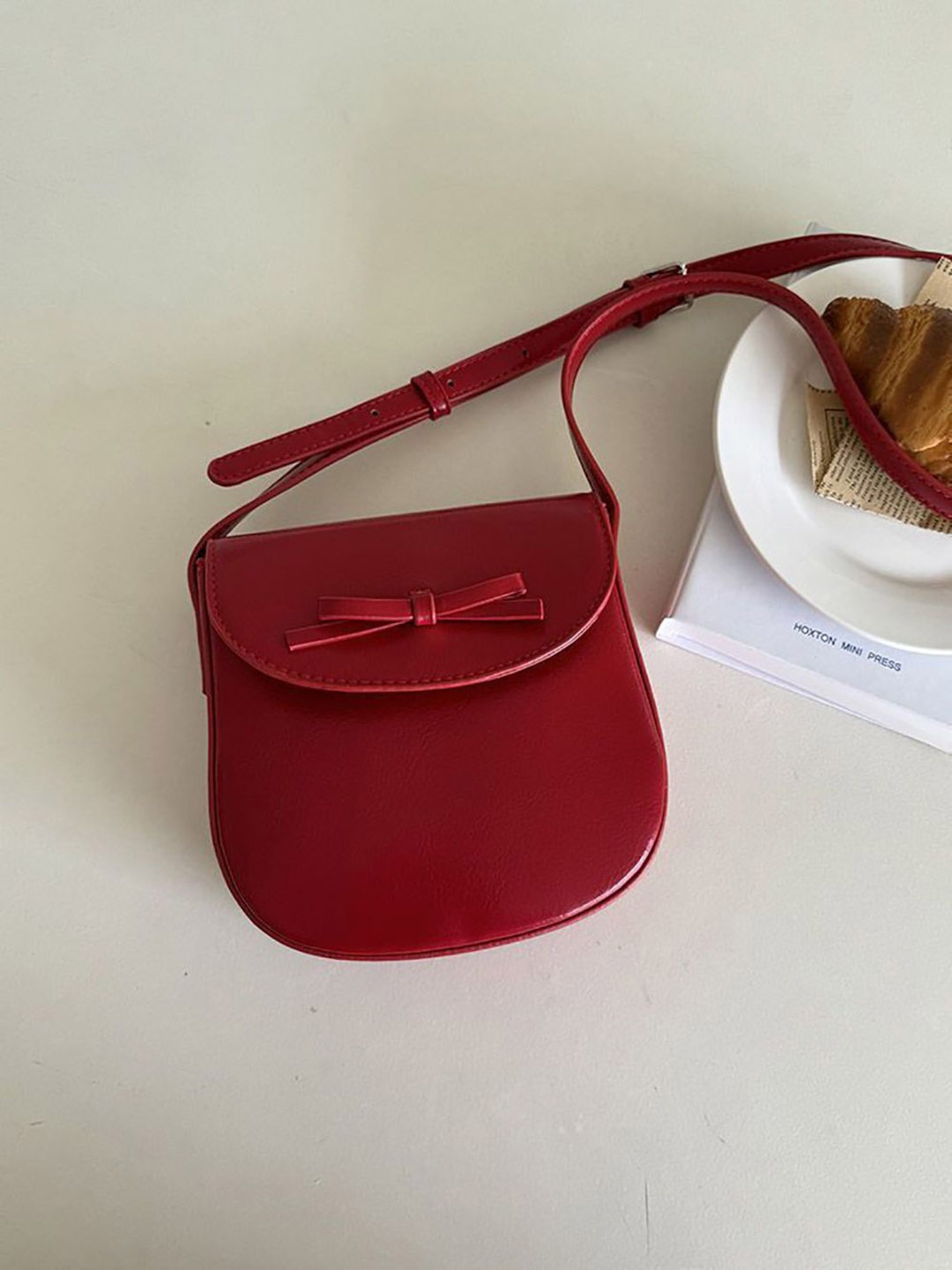

StyleCast x Revolte Women Solid Swagger Sling Bag, Red
