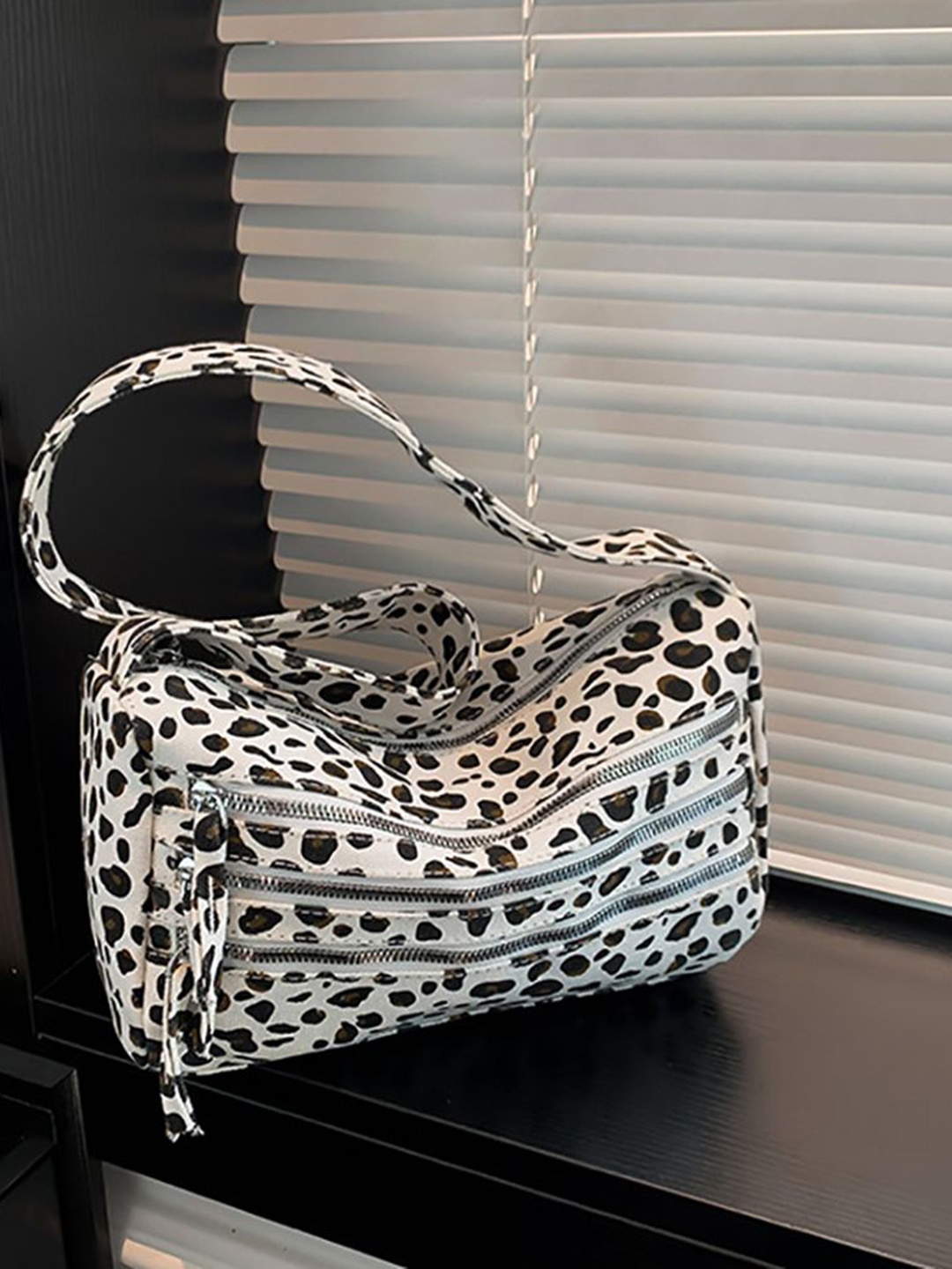 

StyleCast x Revolte Women Animal Printed Swagger Sling Bag, White