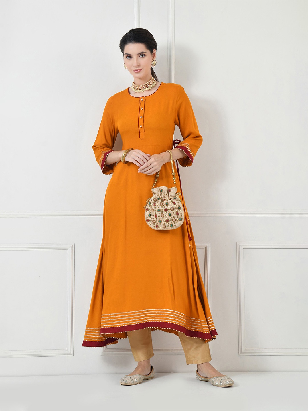 

TOLIKE Women Three-Quarter Sleeves Round Neck Kurta Set, Mustard