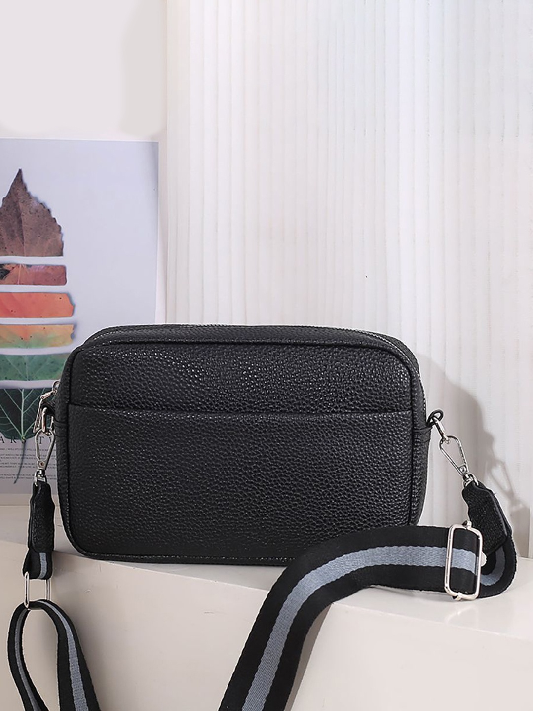 

StyleCast x Revolte Women Textured Swagger Sling Bag, Black