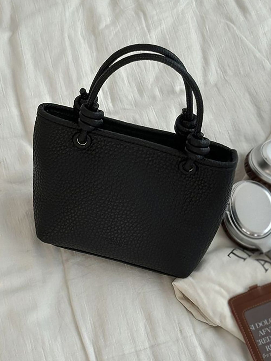 

StyleCast x Revolte Women Textured Swagger Handheld Bag, Black