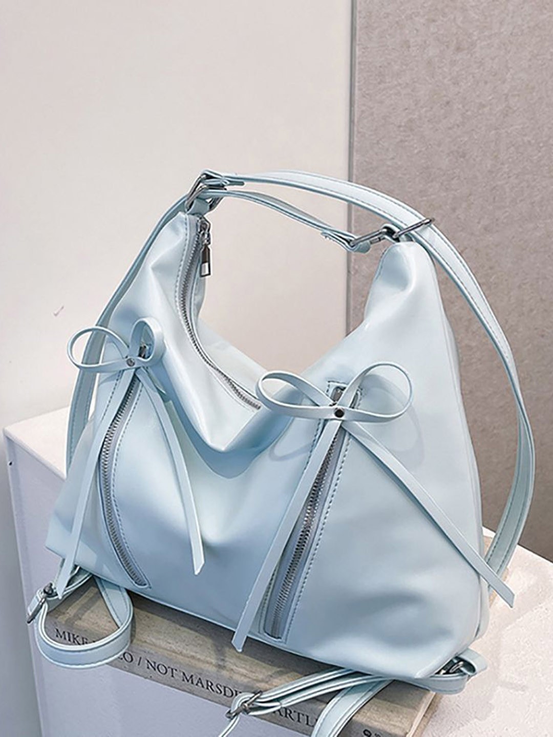 

StyleCast x Revolte Women Solid Swagger Sling Bag, Blue