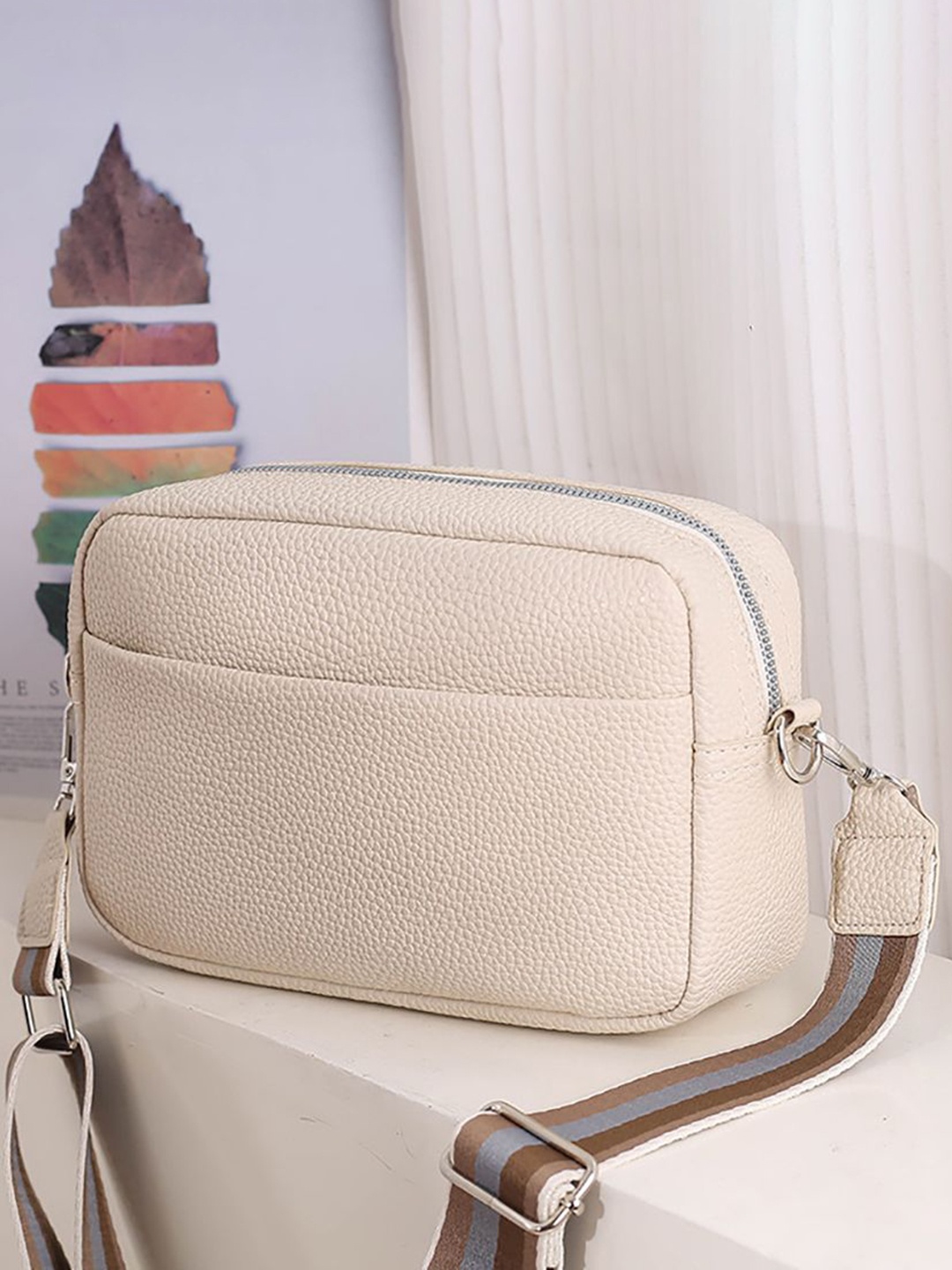 

StyleCast x Revolte Women Textured Swagger Sling Bag, Beige