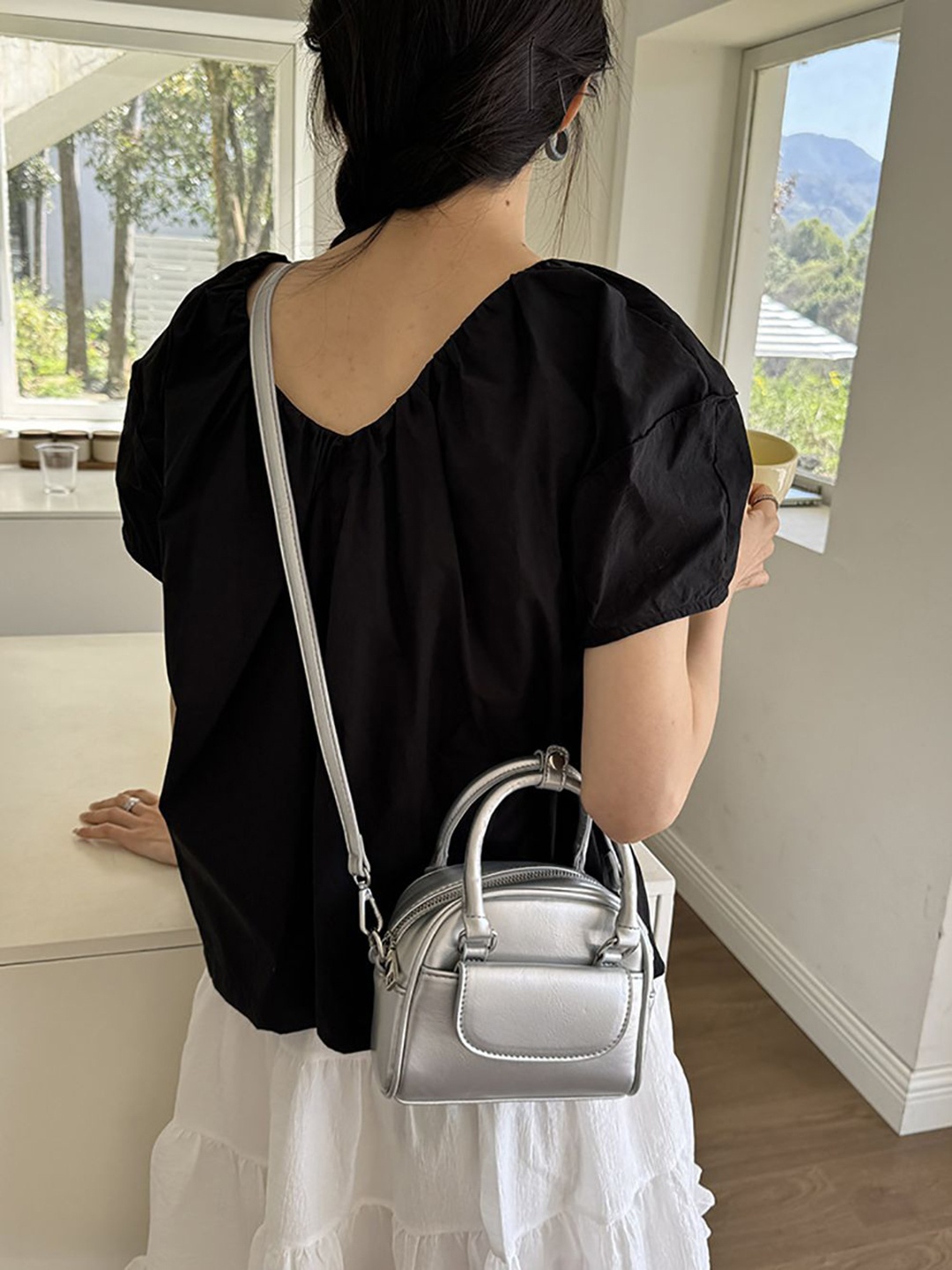 

StyleCast x Revolte Women Solid Swagger Sling Bag, Silver