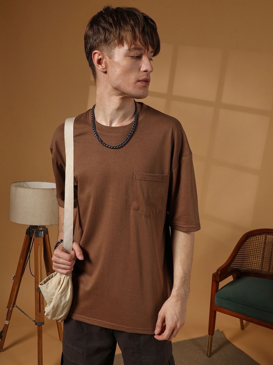 

Campus Sutra Men Solid Round Neck Cotton T-shirt, Brown