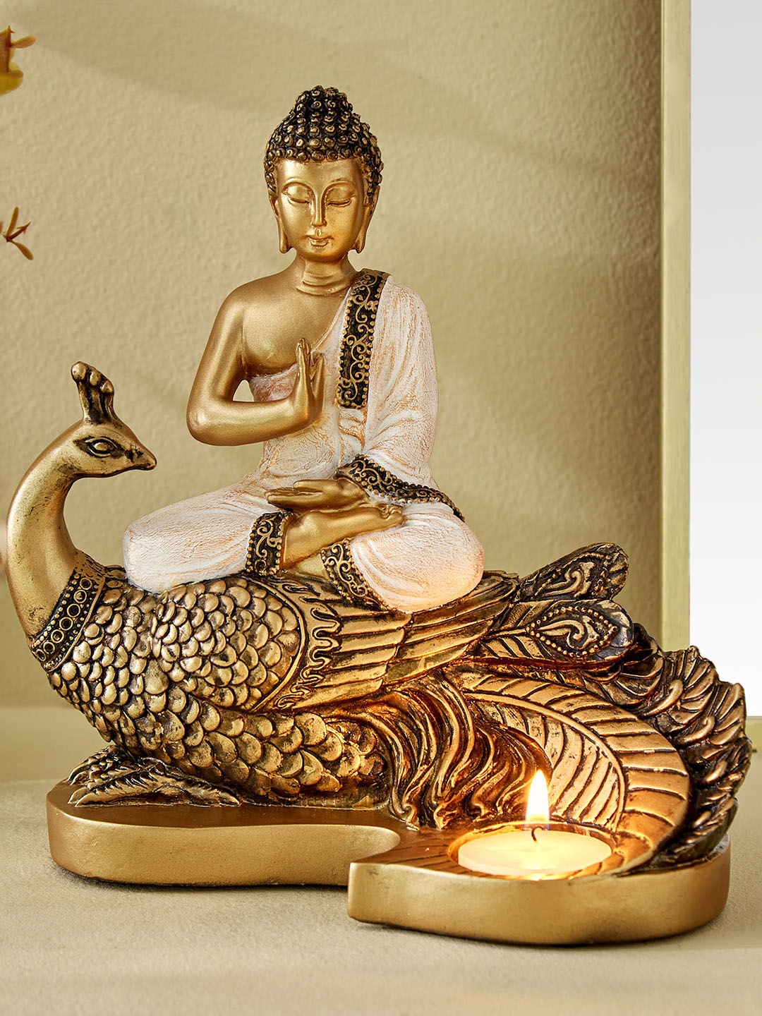 

Home Centre Enlighten Gold-toned & White Buddha on Peacock with T-Light Holder Showpieces