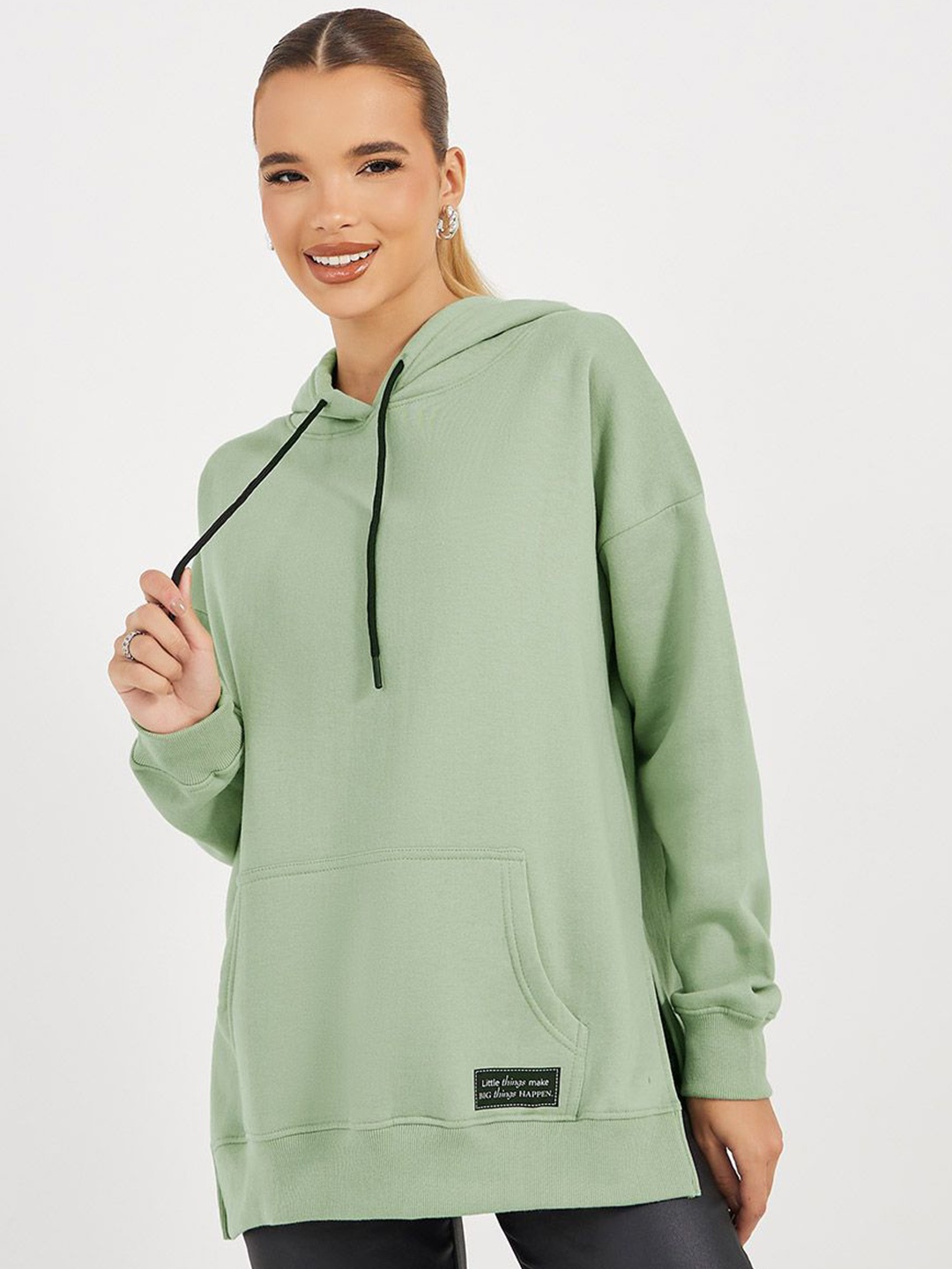 

Styli Women Oversized Fit Longline Hoodie With Badge & Side Slits, Green