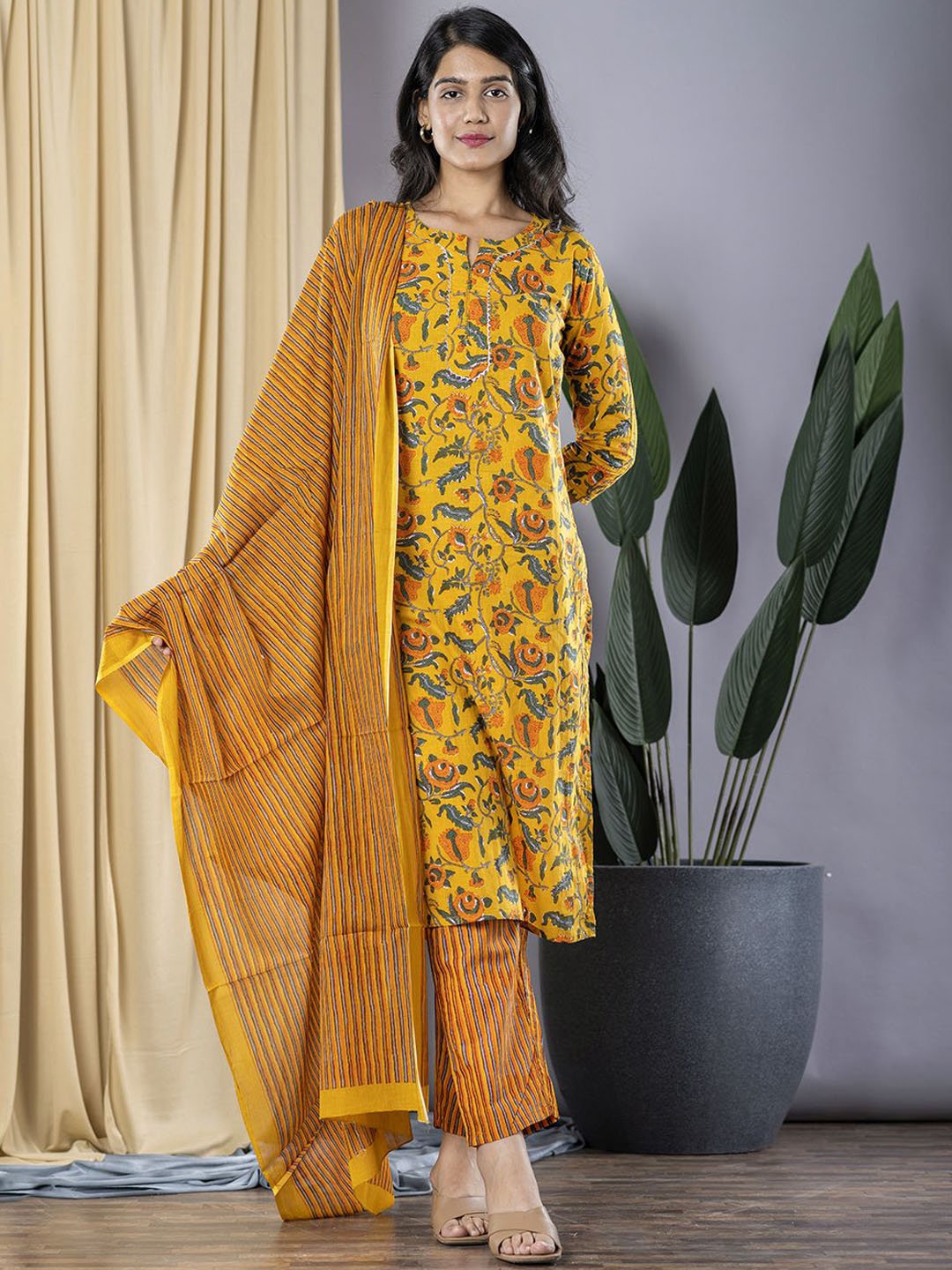 

KALINI Floral Printed Notch Neck Pure Cotton Straight Kurta With Trousers & Dupatta, Mustard