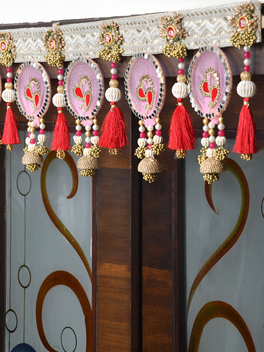 

Aapno Rajasthan Gold-Toned & Pink Floral Embellished Fabric Wall Door Hanging Toran