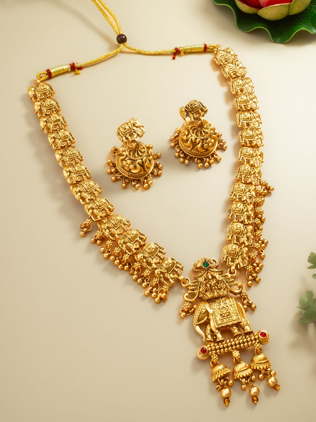 

aadita Gold-Plated Stone-Studded & Beaded Jewellery Set