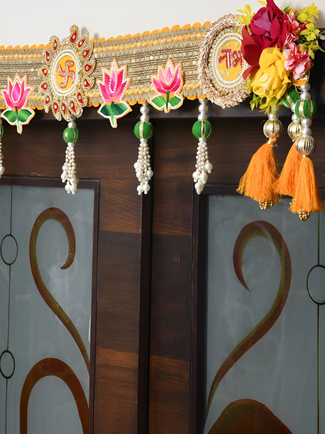 

Aapno Rajasthan Gold-Toned & Yellow Floral Embellished Fabric Toran Festive Decor