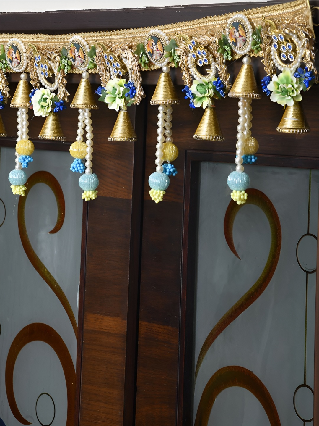 

Aapno Rajasthan Gold-Toned & Yellow Floral Embellished Wall Door Hanging Toran