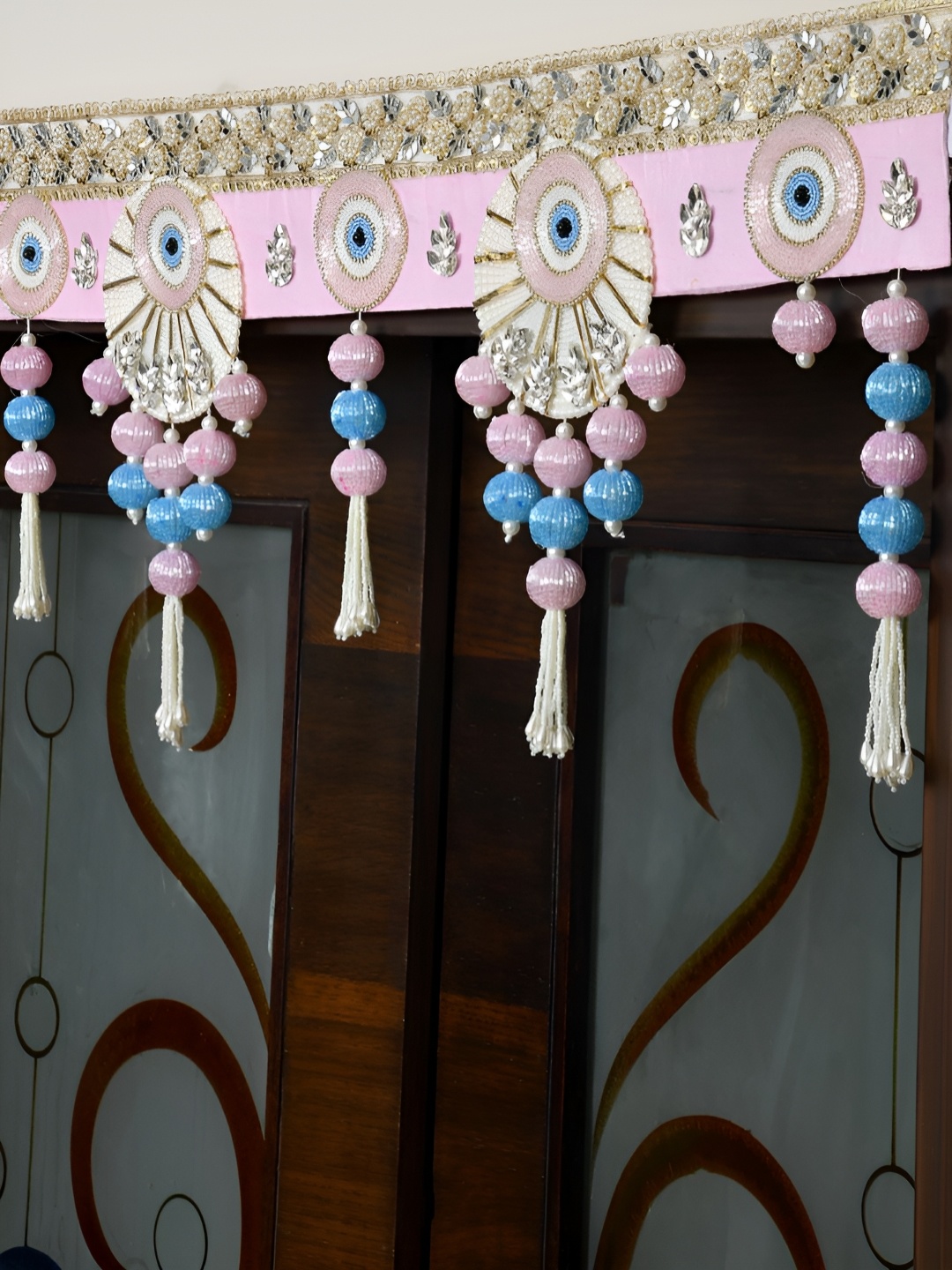 

Aapno Rajasthan Gold-Toned & Pink Embellished Wall Door Hanging Toran