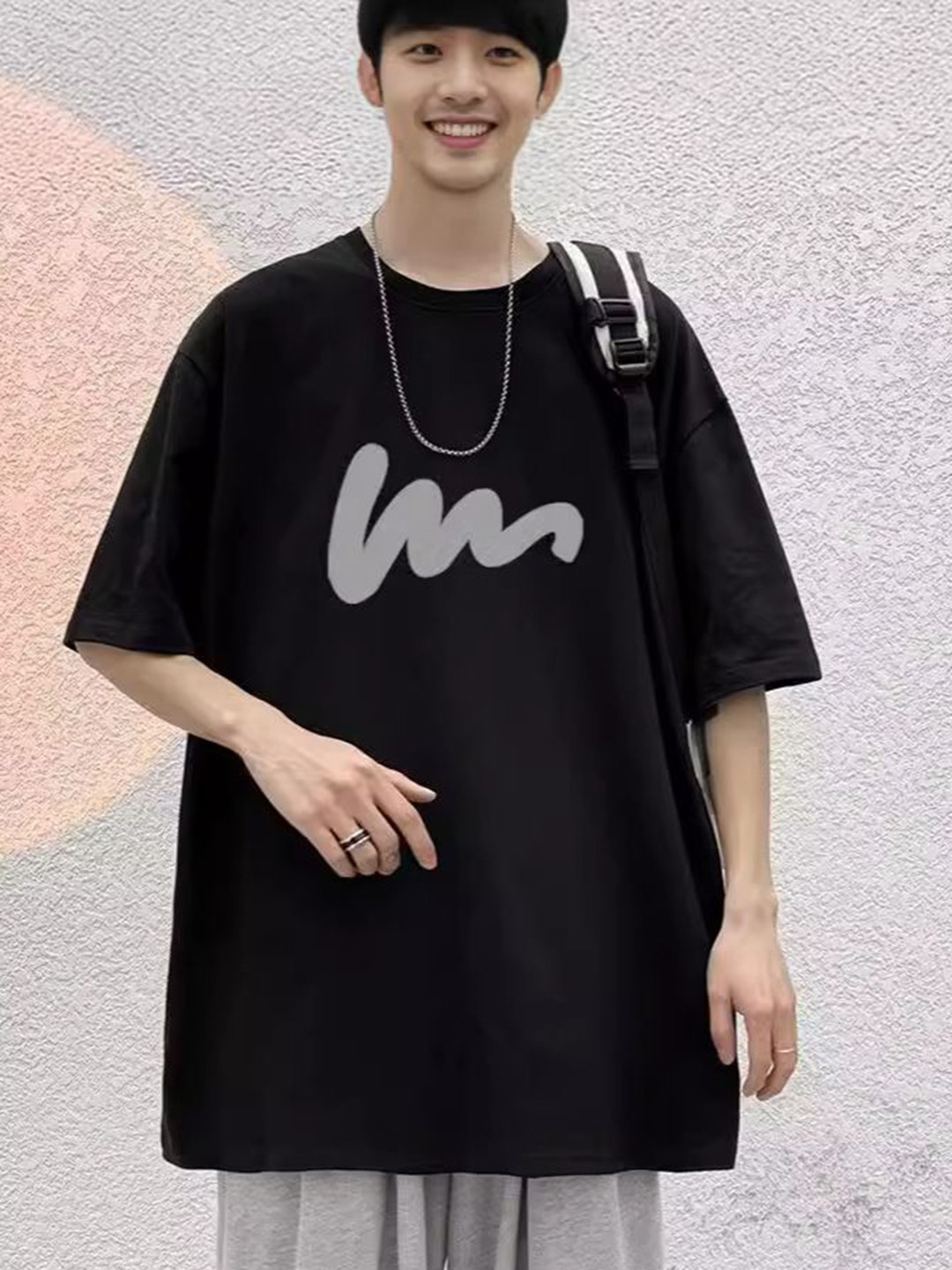 

StyleCast Men Graphic Printed Round Neck Oversized T-shirt, Black