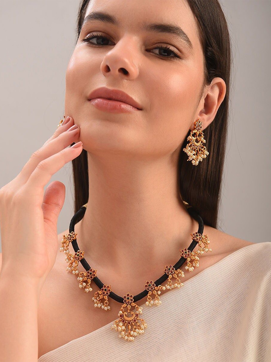 

JAYPORE Gold-Plated Stone Studded Necklace and Earrings