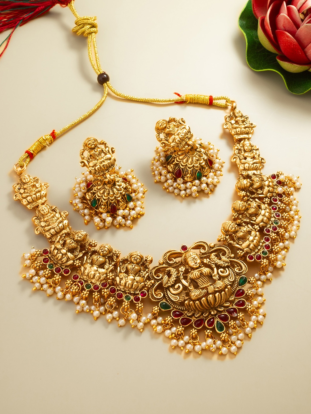 

aadita Gold-Plated Stones-Studded & Beaded Jewellery Set