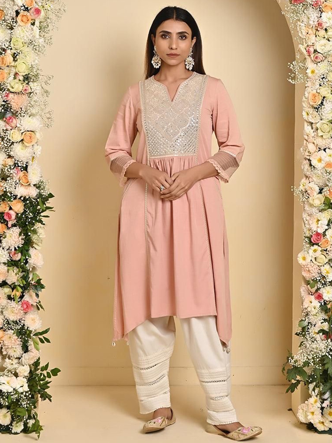 

Lakshita Floral Embroidered Mirror Work Pleated Three Quarter Sleeves Asymmetric Kurta, Peach