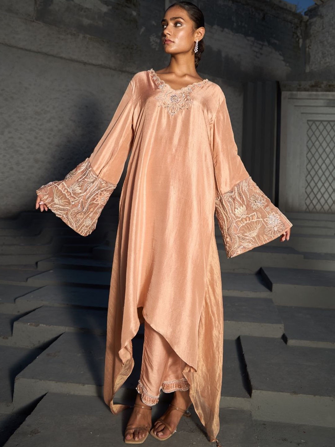 

Shreeka Floral Embroidered Sequinned Dupion Silk Asymmetric Kurta With Trousers, Peach