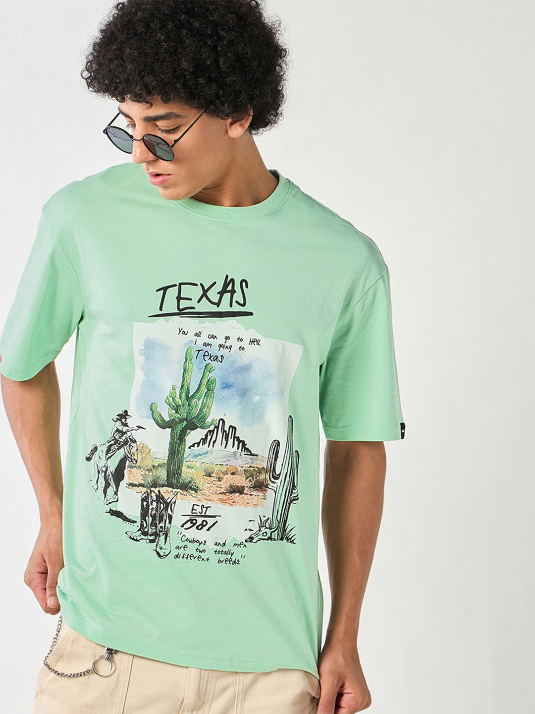 

Bewakoof Men Graphic Printed Round Neck Cotton Oversized T-shirt, Green