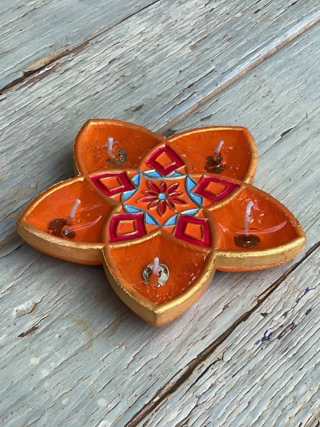 

Ariana Orange-Color & Blue Textured Terracotta Star Scented Diyas