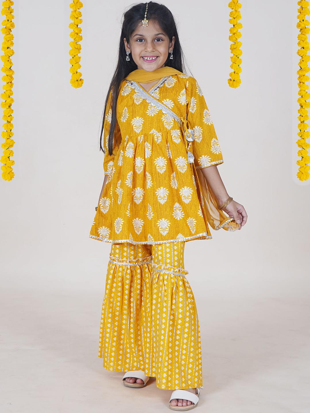 

KiddoPanti Girls Floral Printed Pure Cotton Angrakha Anarkali Kurti With Sharara & Dupatta, Yellow