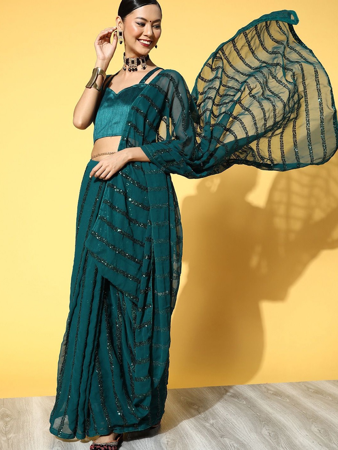 

KAVINDI Striped Sequinned Pure Georgette Saree, Turquoise blue