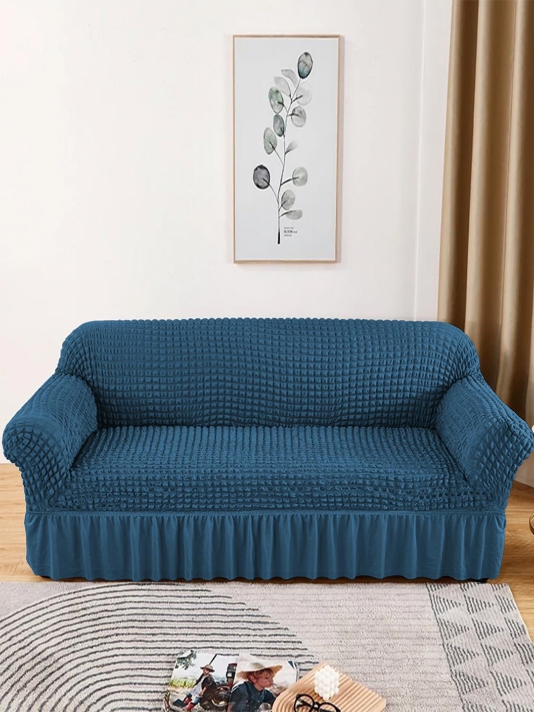 

Lukzer Teal Blue Self Design Sofa Cover With Arms