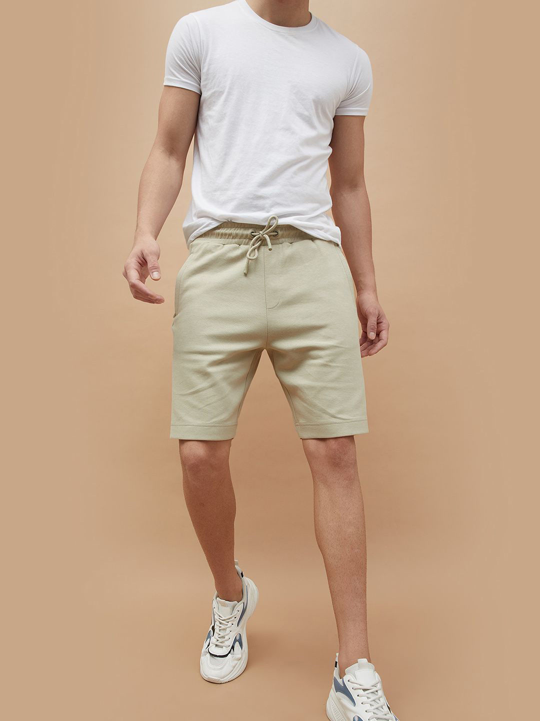 

Kappa Men Solid Mid-Rise Relaxed Fit Regular Shorts, Beige