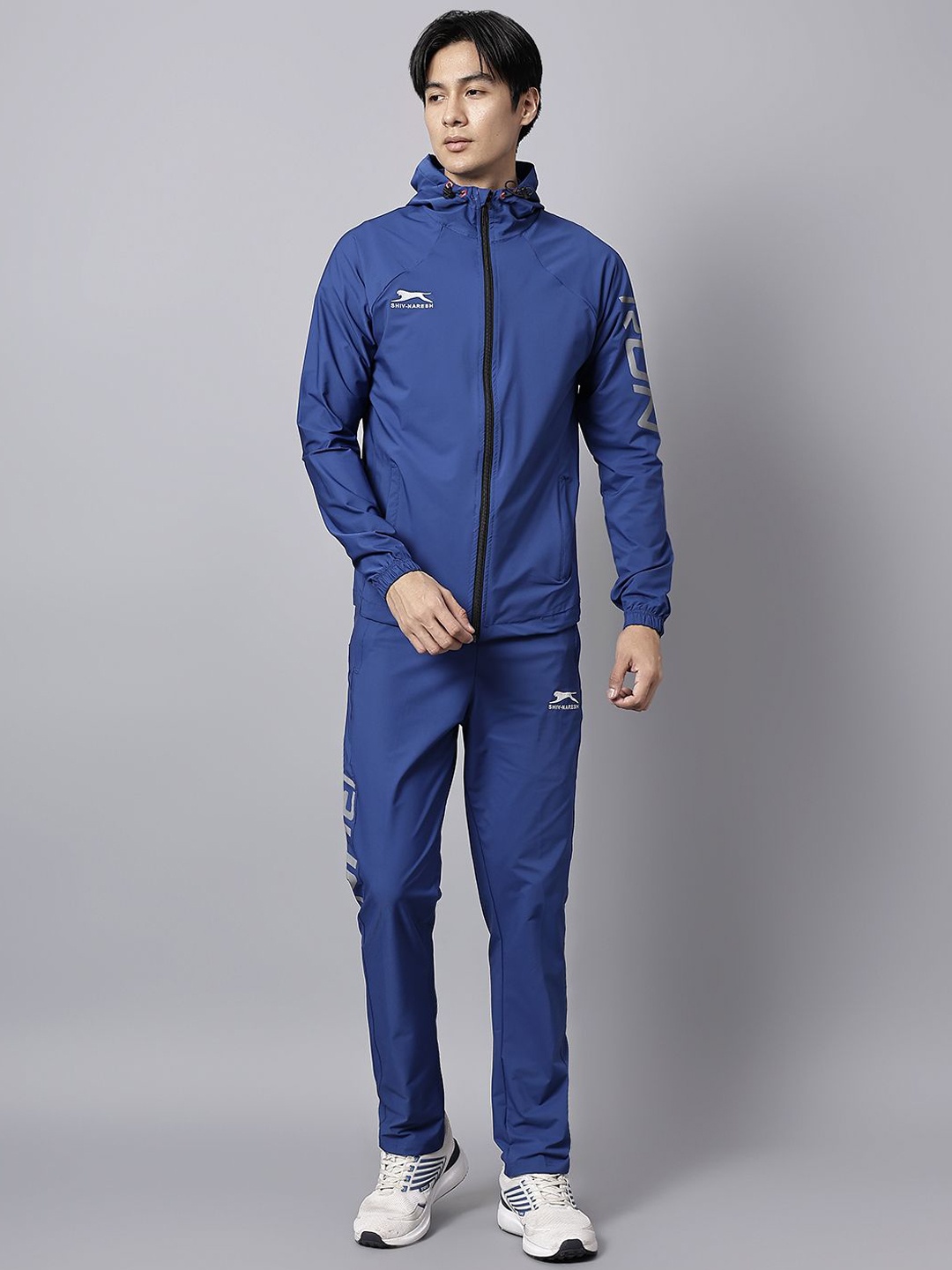 

Shiv Naresh Men Printed Mid-Rise Hooded Tracksuits, Blue