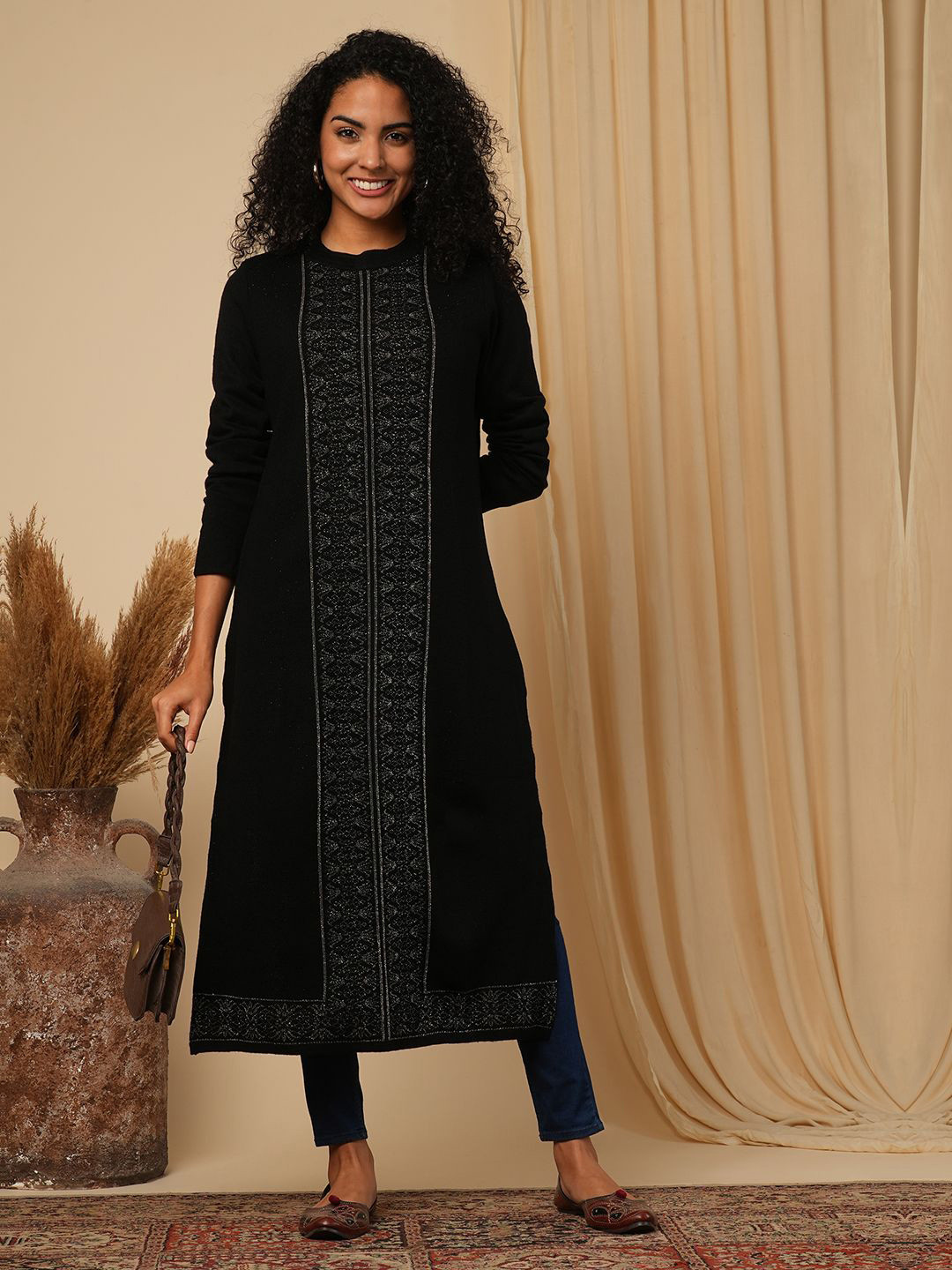 

Globus Women Black Placement Weave Knitted Loose Fit Calf Length Winter Wear Sweater Kurta