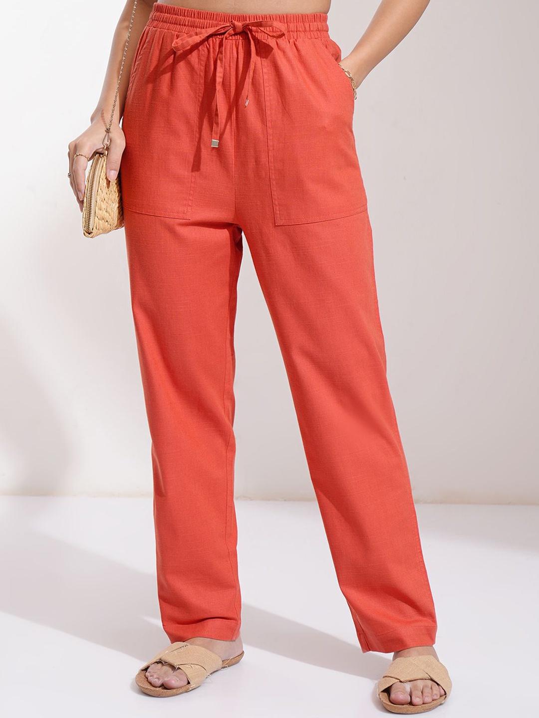 

Tokyo Talkies Women Solid Mid-Rise Regular Trousers, Rust