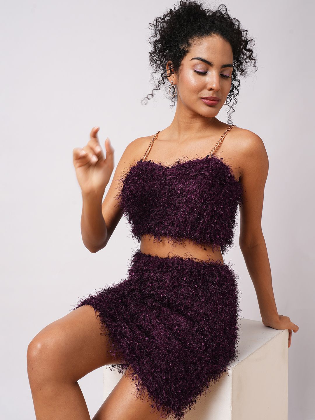 

Globus Burgundy Self Design Chain Shoulder Straps Faux Fur Crop Top With Mini Skirt