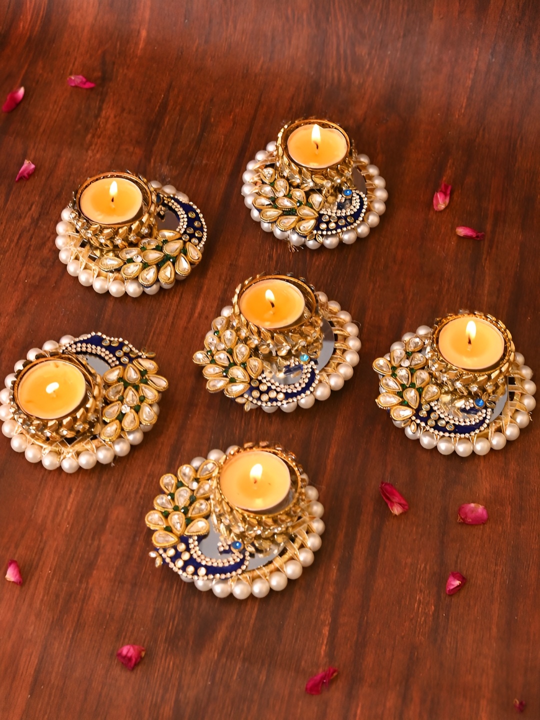 

Aapno Rajasthan Gold-Toned & Blue 6 Pieces Peacock Pattern Tea Light Candle Holder