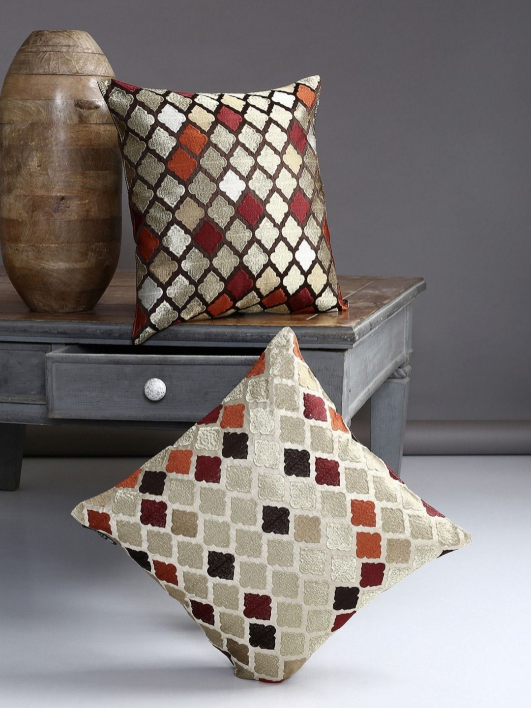 

Myntra Elegant Homes Brown & Red 2 Pieces Geometric Square Cushion Covers