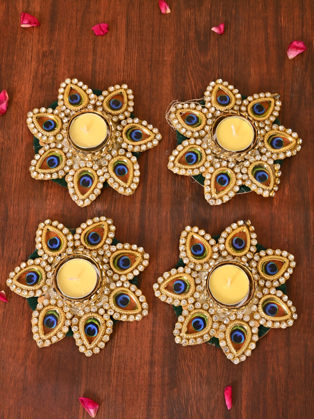 

Aapno Rajasthan Gold-Toned & Blue 4 Pieces Peacock Motif Tea Light Candle Holder